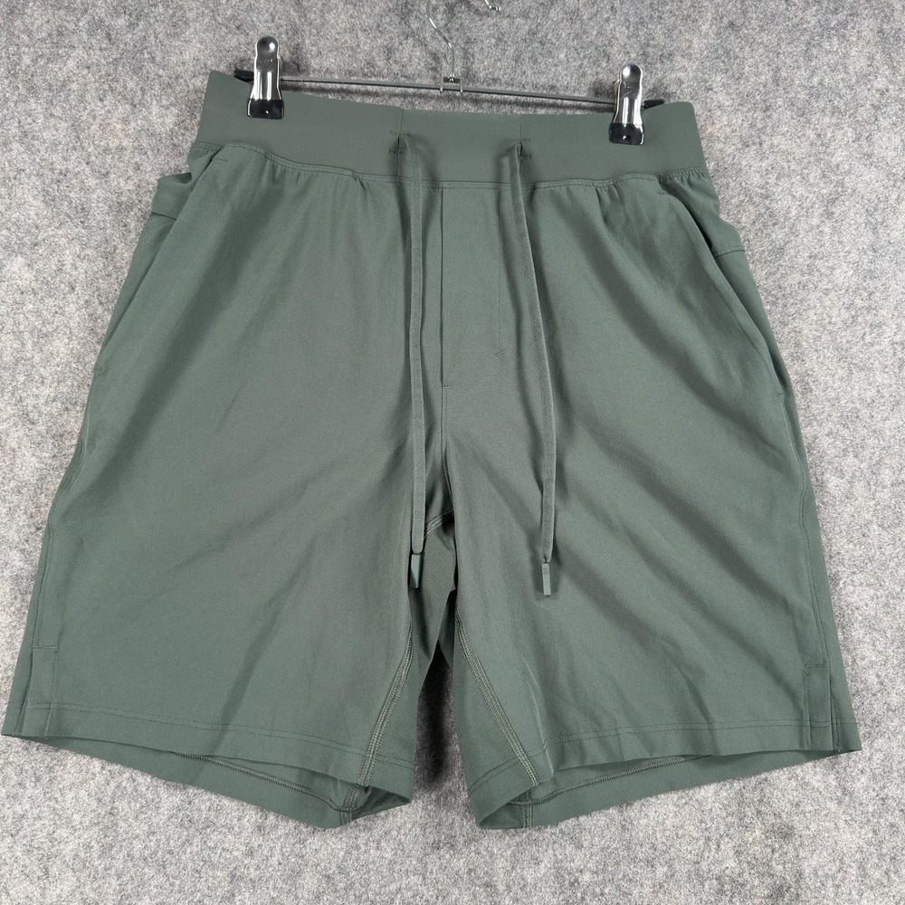 Lululemon T.H.E. Shorts Mens XS Green Stretch Drawstring Zip Pocket Linerless